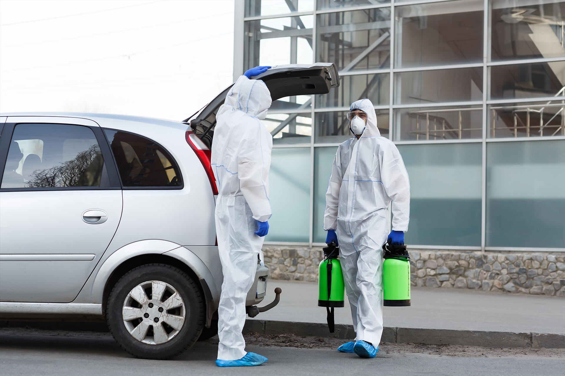 man-in-hazmat-suits-buying-disinfection-spray-for-2021-08-27-18-01-25-2DG27ZY.jpg